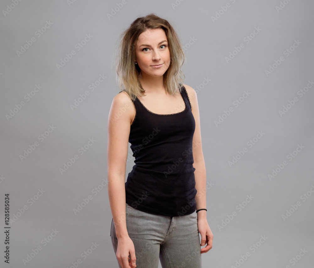 Pretty young woman isolated on gray Pretty young woman isolated on gray