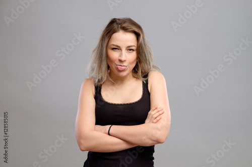 Girl showing tongue closeup portrait