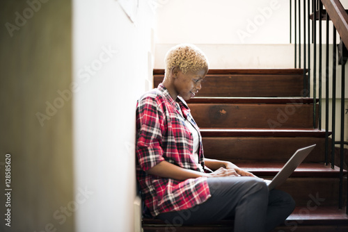African Woman Laptop Social Networking Stairway Concept