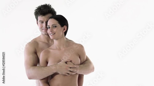 Nude couple smiling at camera