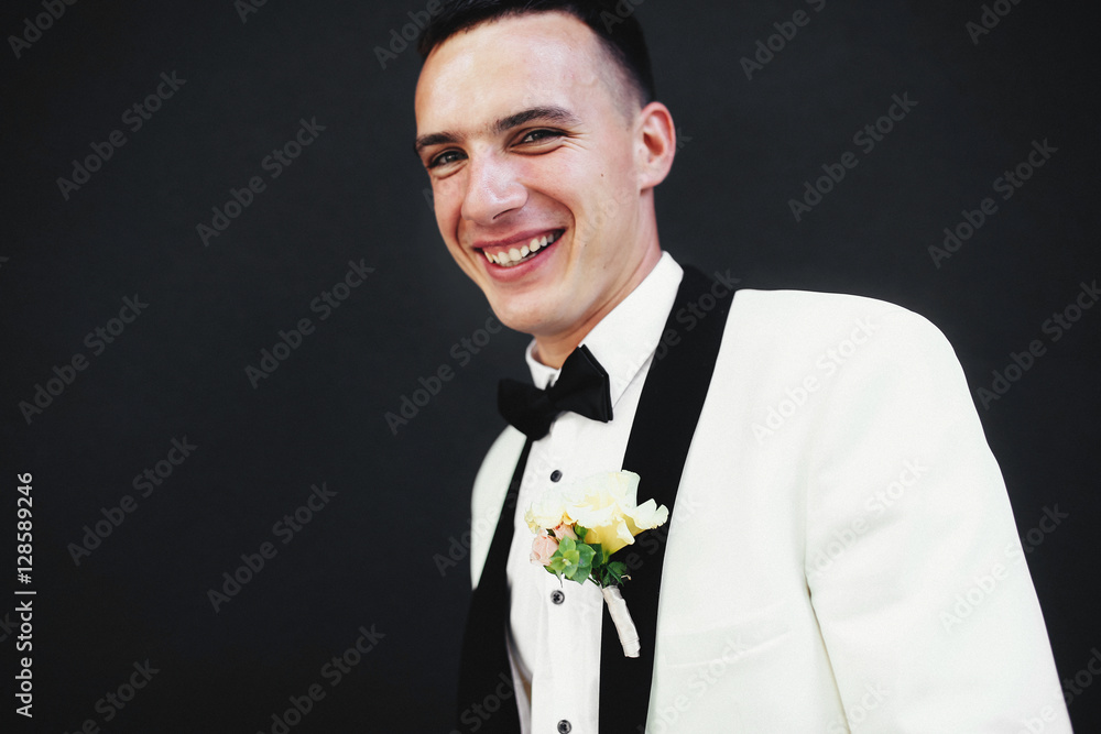 Bright portrait of the happy groom in the bow-tie Bright portrait of the happy groom in the bow-tie