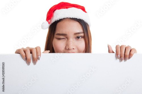 Asian Christmas Santa Claus girl with blank sign.