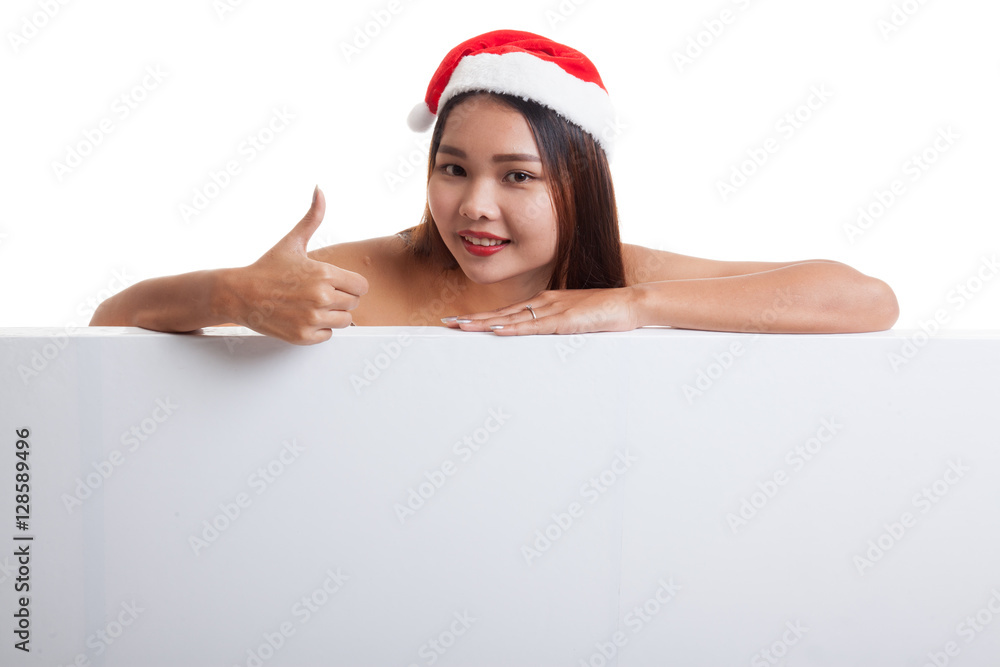 Asian Christmas Santa Claus girl thumbs up with blank sign. Asian Christmas Santa Claus girl thumbs up with blank sign.