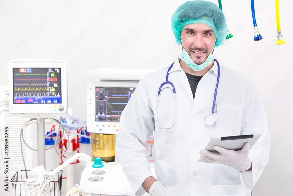 Doctor using digital tablet in operating room Doctor using digital tablet in operating room