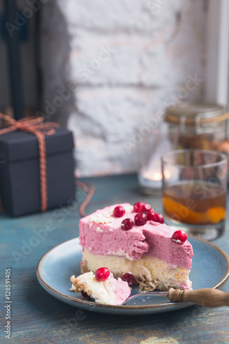Festive cranberry cheescake with fresh berries.
