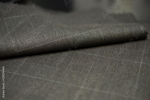close up roll brown with white line fabric of suit