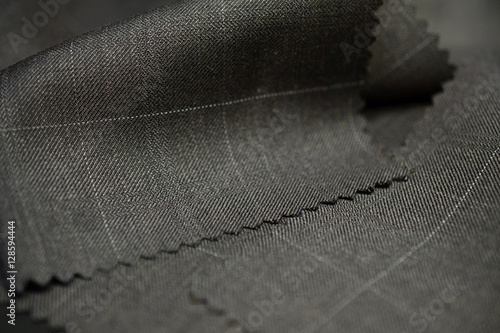 close up texture brown with white line fabric of suit