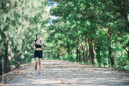 Young fitness woman jogging in park.