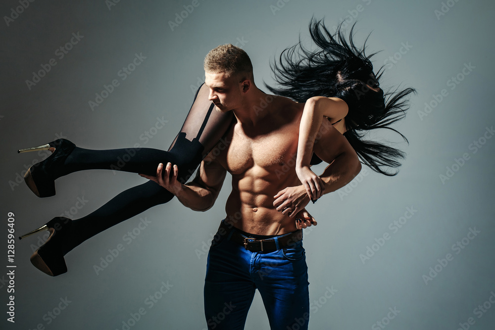 muscular man and sexy girl Stock Photo | Adobe Stock