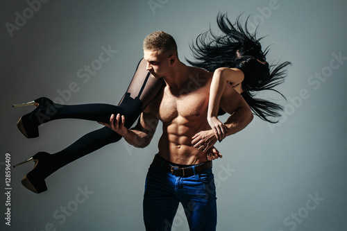 Wallpaper Mural muscular man and sexy girl Torontodigital.ca