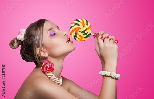 stylish portrait of a sweet girl with candy.