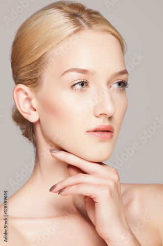 Fashion blonde woman with beautiful face - isolated on white. Skin care concept.