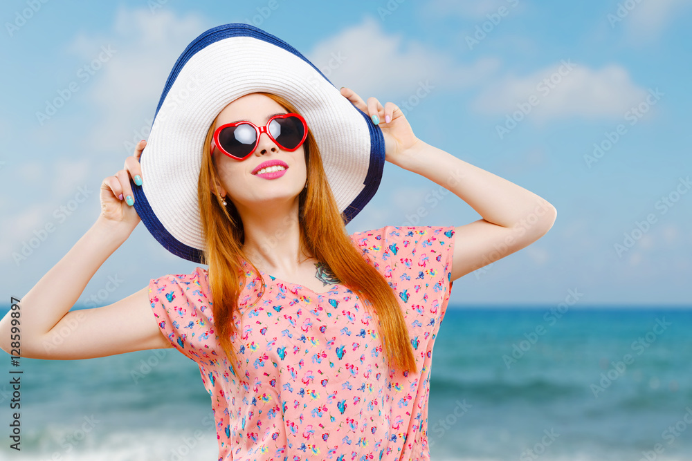 Smiling girl with hat and sunglasses Smiling girl with hat and sunglasses