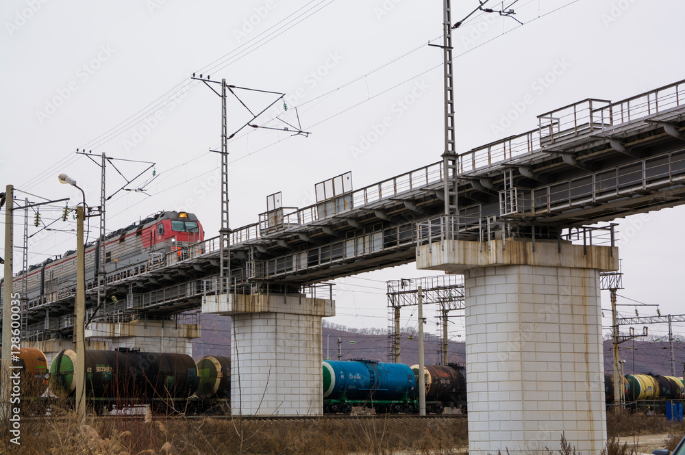 Railway junction with big concrete bridge.