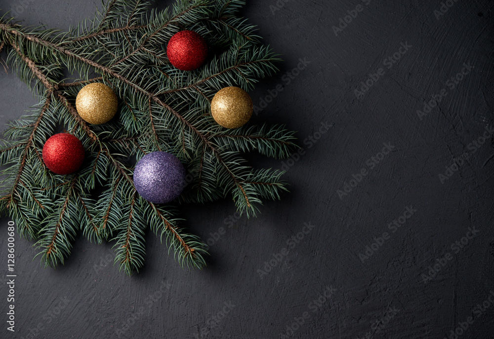 Christmas decorations with fir-tree branches, New Year's spheres, tangerines and candies
Christmas decorations with fir-tree branches, New Year's spheres, tangerines and candies