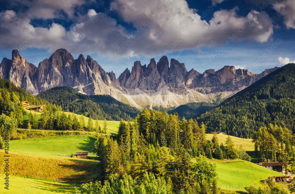 Countryside view of the Funes valley St. Magdalena or Santa Maddalena in the National park Puez Odle or Geisler. Dolomites, South Tyrol. Location Bolzano, Italy, Europe. Dramatic scene. Beauty world.