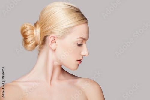 Fashion blonde woman with beautiful face - isolated on white. Skin care concept.