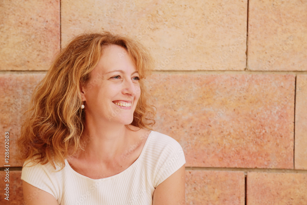 Portrait of beautiful 40 years old woman outdoors