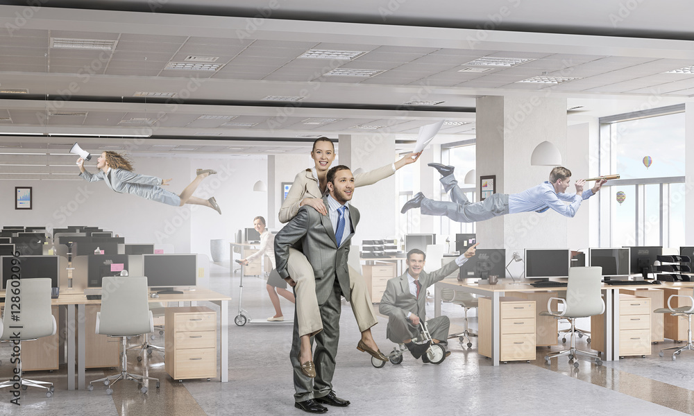 Businesspeople having fun in office . Mixed media Businesspeople having fun in office . Mixed media