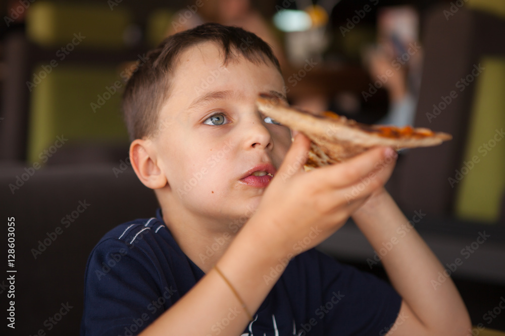 Child having fun eating pizza bar restaurant Child having fun eating pizza bar restaurant