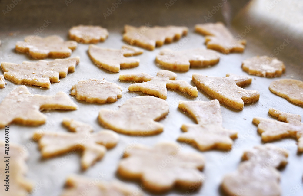 Christmas cookies or christmas baking with cookie dough and christmas ornaments. Cookie cutters. Christmas cookies or christmas baking with cookie dough and christmas ornaments. Cookie cutters.