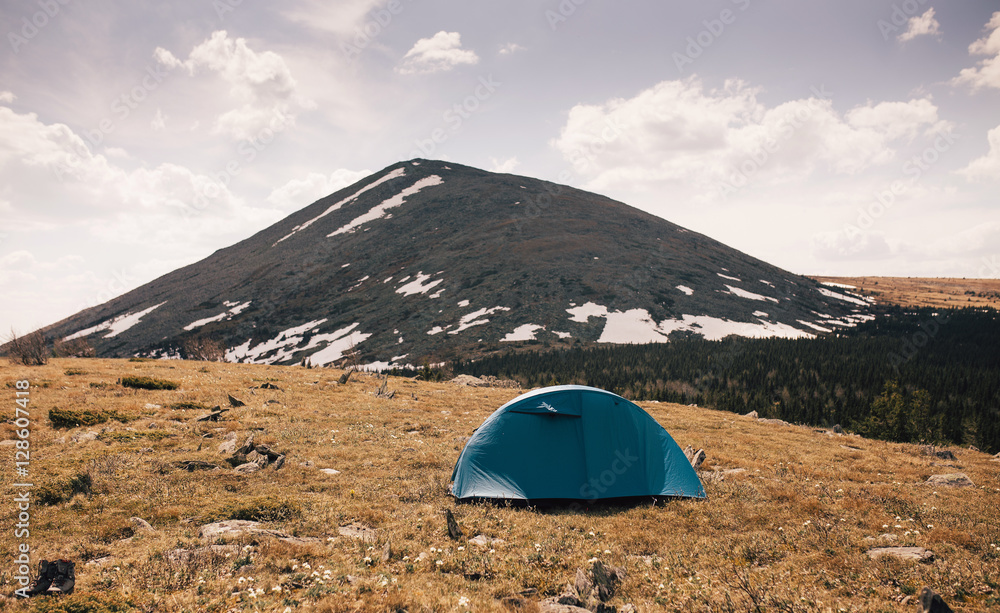 camping in the mountains and hills with tent