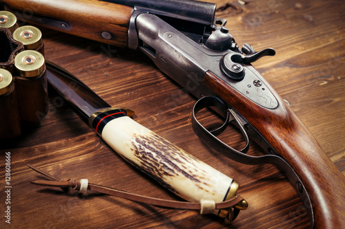 Shotgun on wooden background