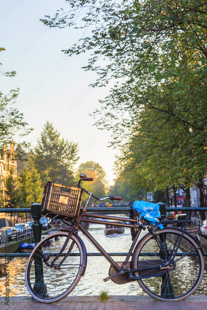 Vintage bicycle in dutch canal cityscape, The Netherlands