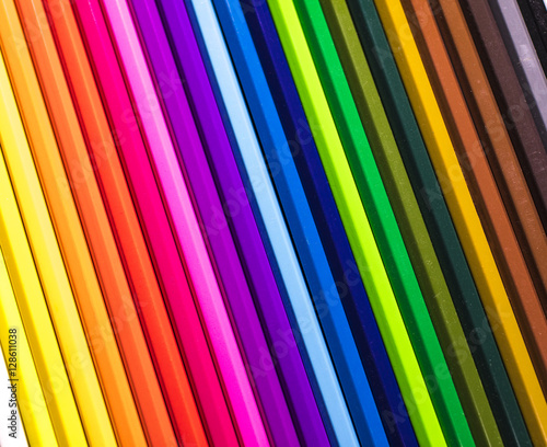 Coloured pencils lined in a row