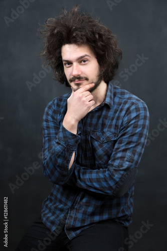 Portrait of a fashionable young man on dark background  chalkboa