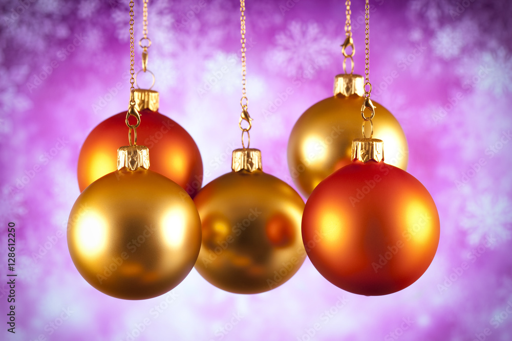Fototapeta premium Gold and red Christmas baubles on abstract background