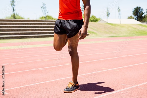 Athlete warming up on the running track © WavebreakMediaMicro