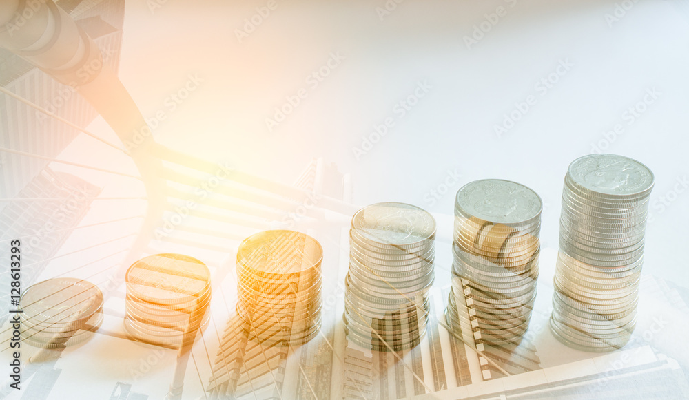 Double exposure of coins and modern city background, Finance and banking concept