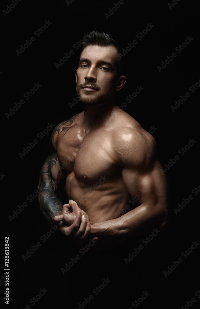 Fototapeta premium Strong athletic man showes naked muscular body