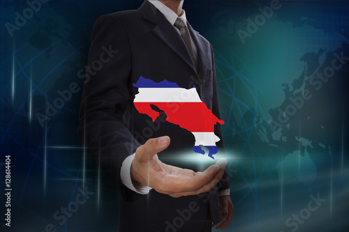 Businessman showing map of Costa Rica on globe background