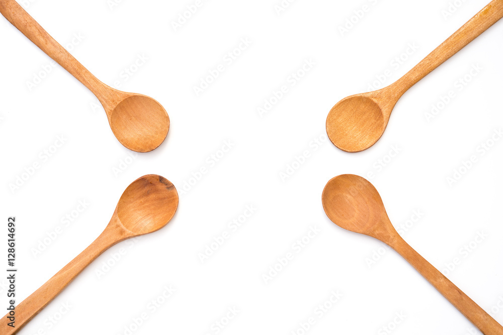 four empty wooden spoons on white background four empty wooden spoons on white background