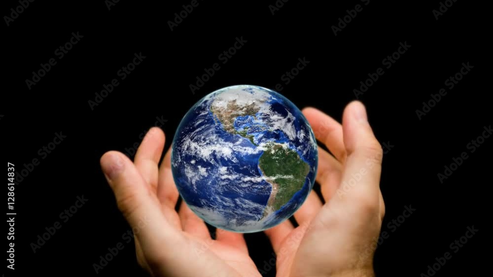 Orbiting globe in human hands on black background. Orbiting globe in human hands on black background.