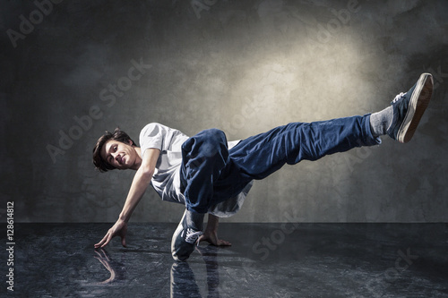 urban hip hop dancer over grunge concrete wall