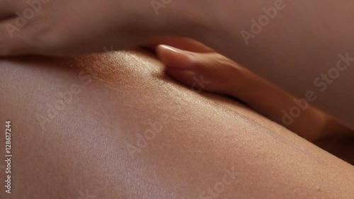 Sensual body lotion applying on female tanned legs with hands 4K 2160p 30fps UltraHD footage - Beautiful woman skin hydration with creme 3840X2160 UHD video 