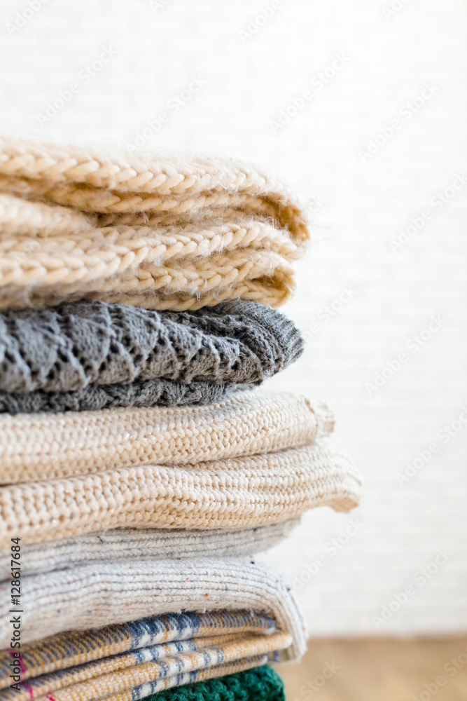 Stack of white cozy knitted sweaters Stack of white cozy knitted sweaters