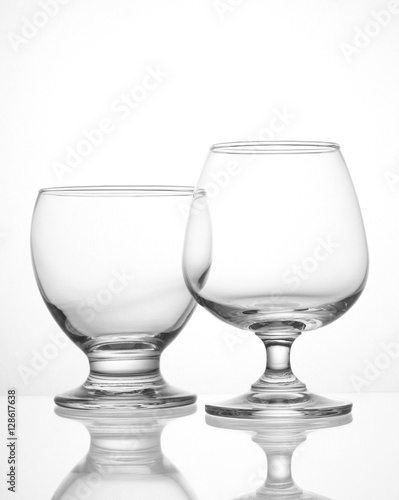 Empty wine glasses closeup shot on white isolated.