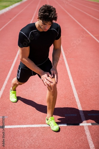 Athlete warming up on the running track © WavebreakMediaMicro