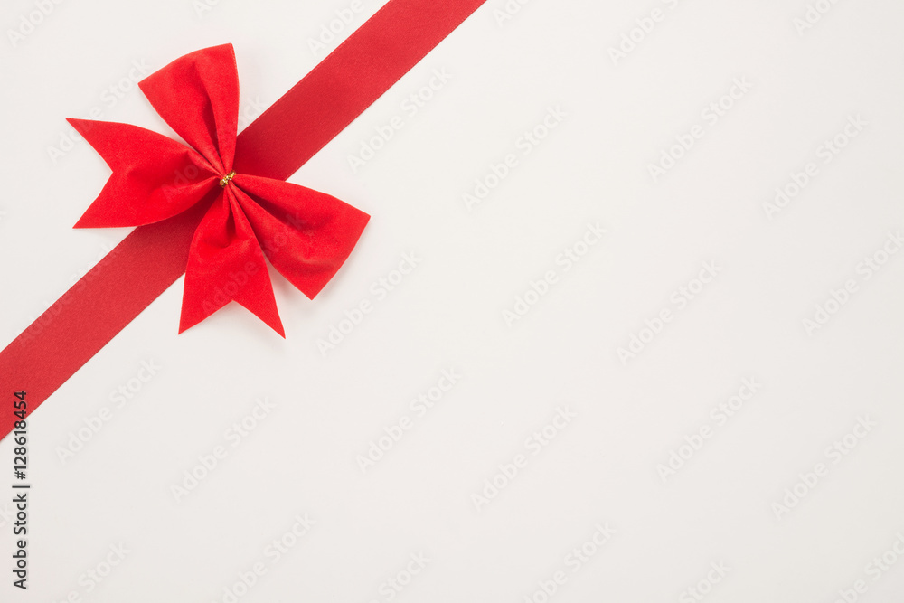  Decorative red ribbon and bow on a white background