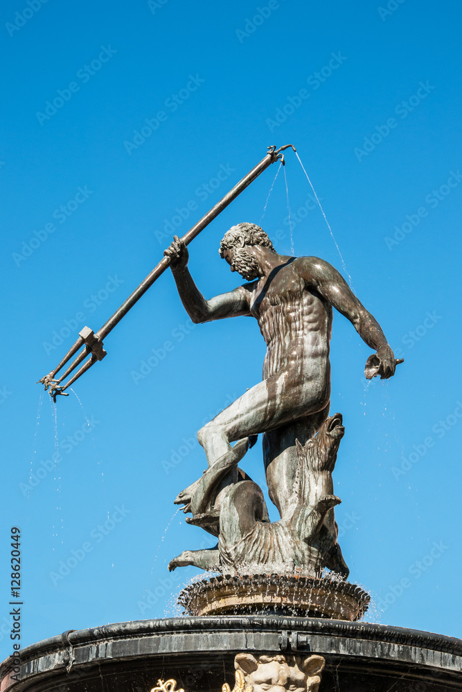 Obraz premium Neptune statue and fountain in Gdansk, Poland, dating from 1549, on blue sky