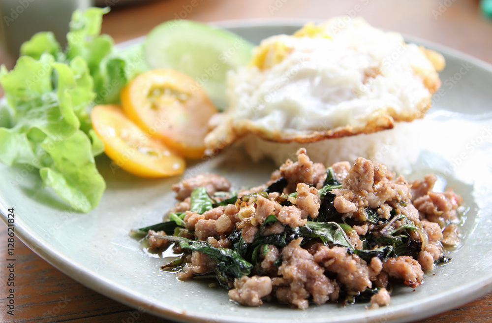 Stir-fried pork with basil leaves and fried egg on rice. Stir-fried pork with basil leaves and fried egg on rice.