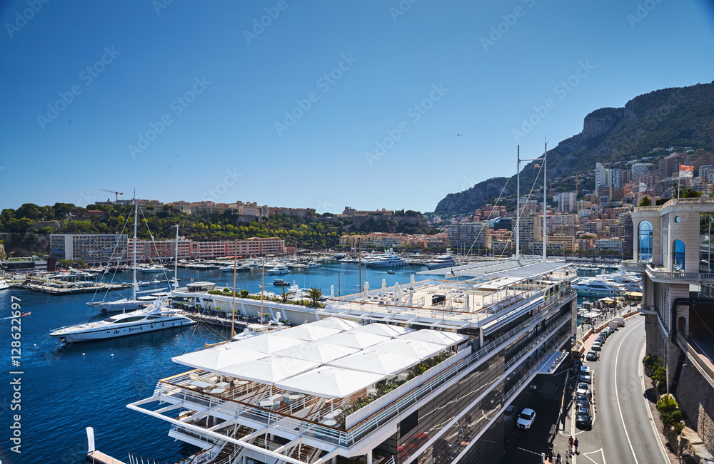 Monaco, Monte-Carlo, Monaco Ville, 8 August 2016: Port Hercules, the preparation of the yacht show MYS, New Yacht club, sunny day, many yachts and boats, Prince's Palace of Monaco, megayachts