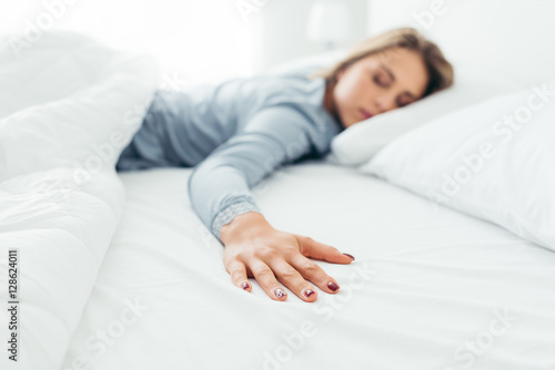 Lonely woman in bed