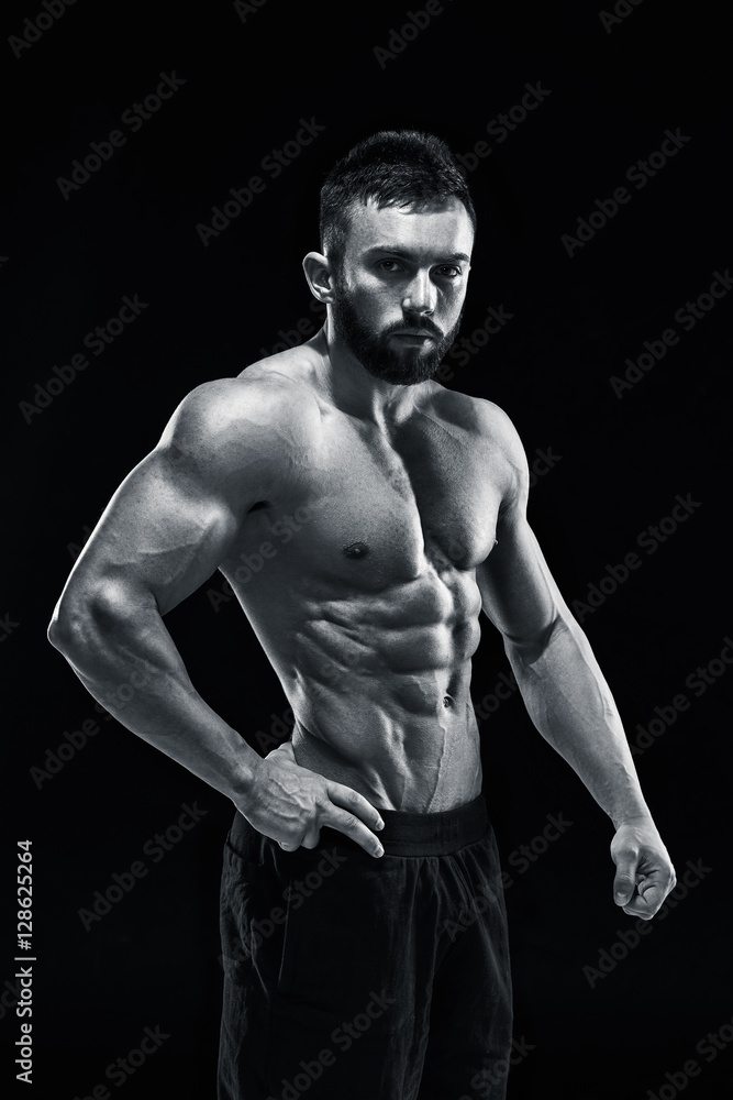 Muscular bodybuilder guy doing posing Muscular bodybuilder guy doing posing