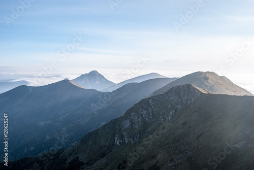 autumn morning panorama of Krivanska Mala Fatra mountain range from Chleb hill above Vratna dolina in Slovakia with blue sky