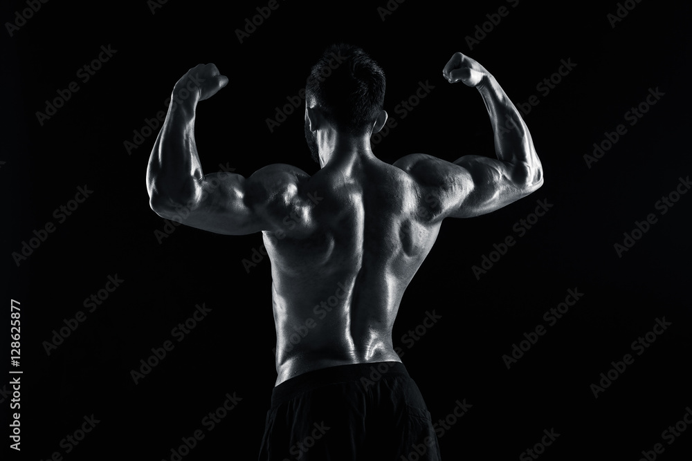 Obraz premium very muscular man posing with naked torso in studio